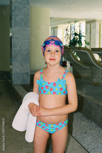 Portrait of girl before training in the swimming pool.