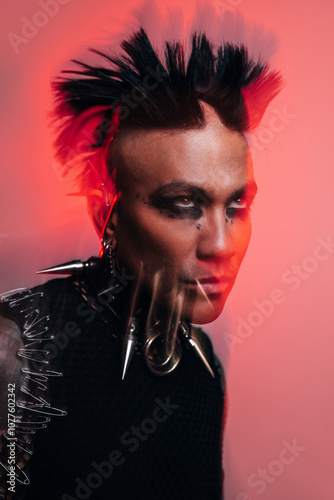 Punk-inspired fashion man with edgy makeup and bold accessories photo