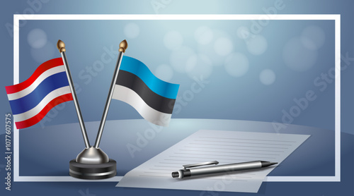 Thailand and Estonia National flags on small table with bokeh background, cooperative relationship
