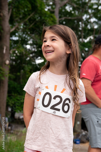 Portrait of happy child competing in running race