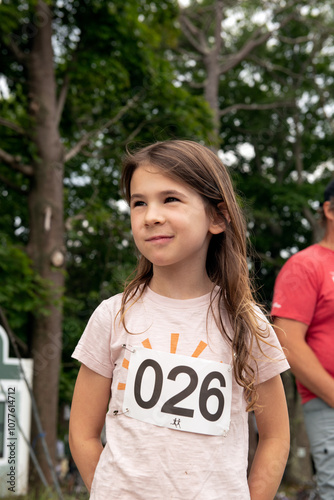 Portrait of happy child competing in running race photo