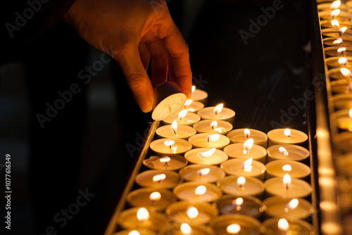 Sensual lighting of tea lights to commemorate deceased loved ones