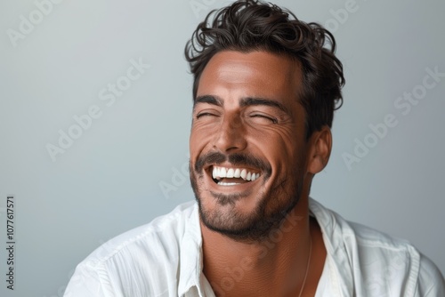 professional portrait of a handsome young man with perfect smile isolated on white background laughing and smiling