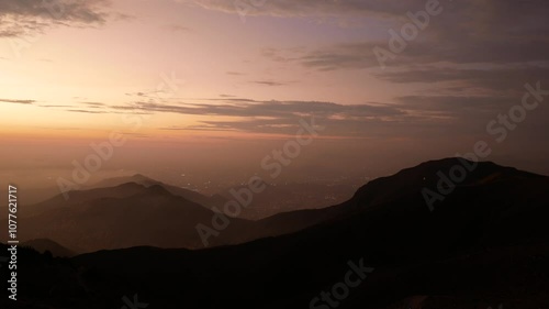 Clouds Between the Hills Seen from the Viewpoint “Apu Siqay”,  in Villa del Triunfo, Lima, Peru at Sunset photo