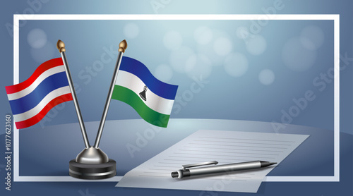 Thailand and Lesotho National flags on small table with bokeh background, cooperative relationship