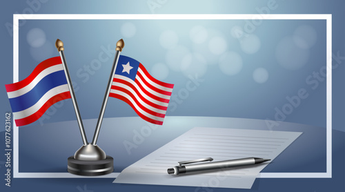 Thailand and Liberia National flags on small table with bokeh background, cooperative relationship
