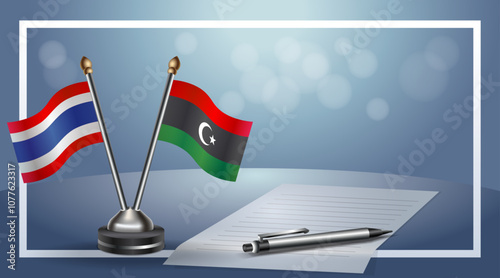 Thailand and Libya National flags on small table with bokeh background, cooperative relationship