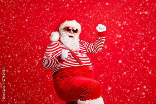 Portrait of his he nice handsome attractive cheerful cheery glad thick gray-haired Santa festal bargain celebration dancing isolated over bright vivid shine vibrant red color background