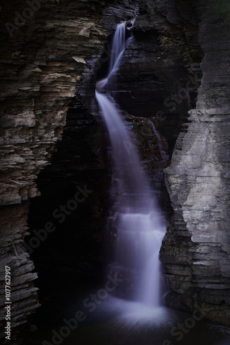 Long exposure of water cascading over rocks in Watkins Glen photo