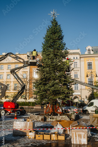 Installation of a Christmas tree in the city square photo