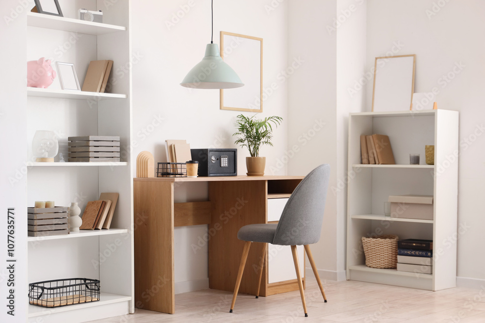 Fototapeta premium Interior of modern home office with safe on wooden table