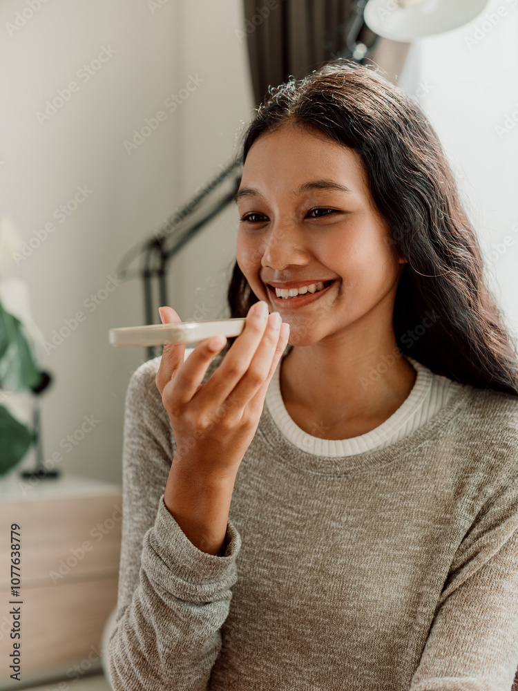 Happy Woman Using Smartphone Voice Assistant at Home Happy Woman Using Smartphone Voice Assistant at Home