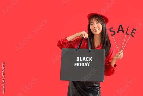 Stylish young Asian woman w...