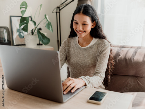 Wallpaper Mural Young Woman Smiling While Working on Laptop at Home Torontodigital.ca