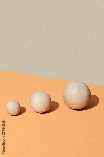 wooden balls of different sizes arranged from smallest to largest photo