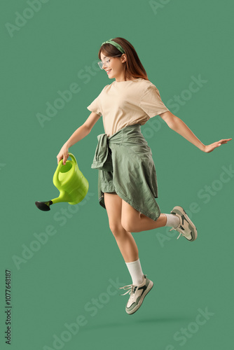 Female gardener with wateri...