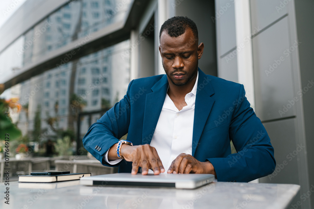 Businessman using laptop at outdoor workspace Businessman using laptop at outdoor workspace