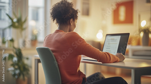 Person sitting at desk with poor posture, emphasizing the importance of ergonomic practices for maintaining health and productivity in the workplace.