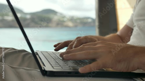 Remote working lifestyle enjoying work in a van by the beach