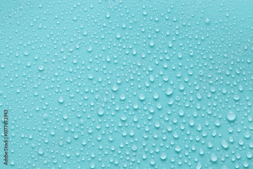 Water drops on turquoise background, above view