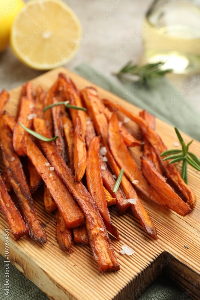 Delicious sweet potato fries with spices on table, closeup Delicious sweet potato fries with spices on table, closeup