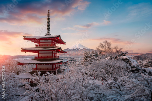 Fujiyoshida, Japan Beautiful view of mountain Fuji and Chureito pagoda at sunrise of Mount Fuji during winter.This is one of the famous spot to take pictures of Mount Fuji.