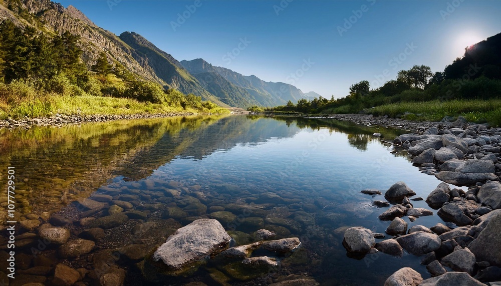 Fototapeta premium Clear River Water Reflecting on Stones in Mountain Landscape