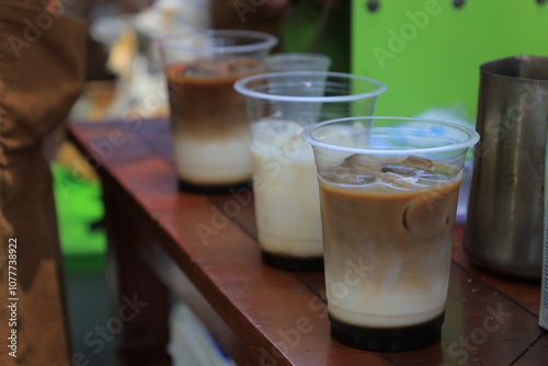 Es Kopi Susu (Coffee Milk Ice) in a plastic cup inside