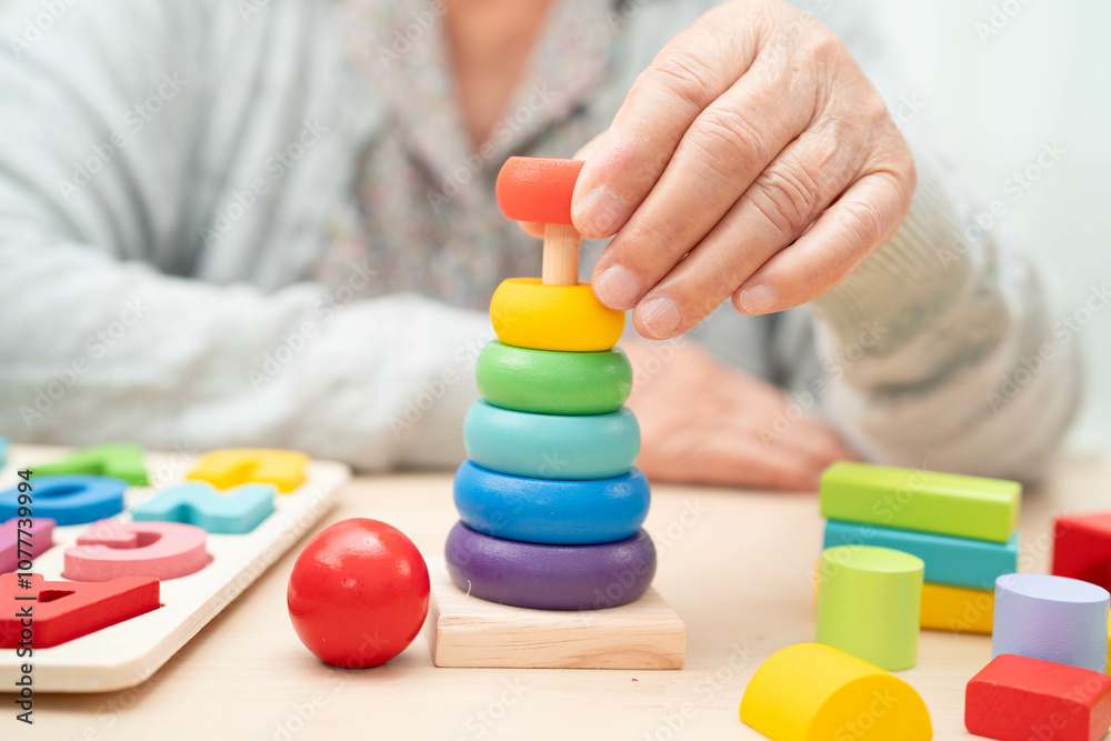 Asian elderly woman playing game. Asian elderly woman playing game.