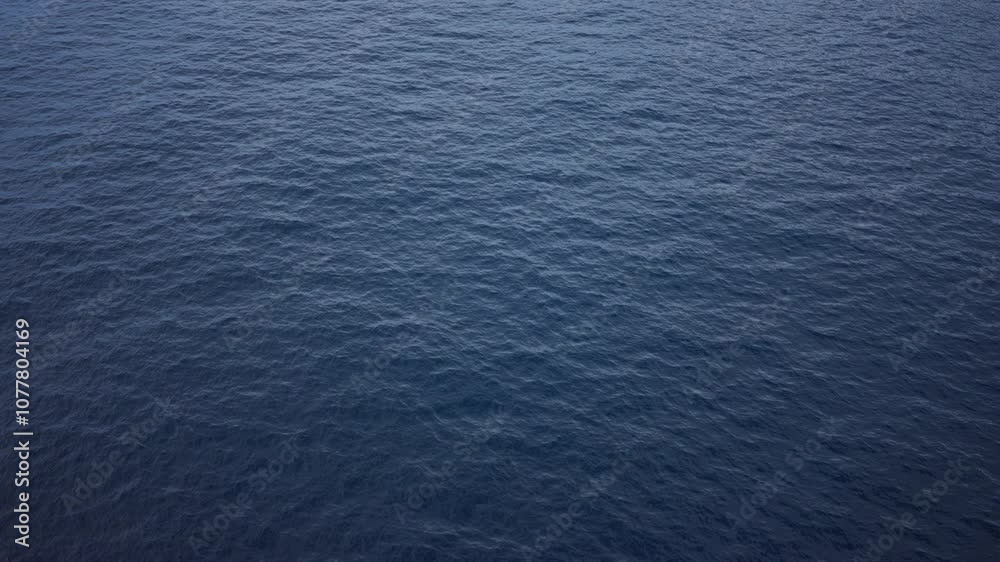 Calm ocean surface with gentle waves and rich blue hues in an outdoor seascape scene capturing peaceful, tranquil, and natural water environment background.