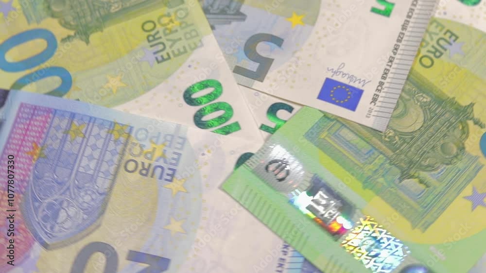 European Union Money: Different Euro Banknotes Rotating. Euro Currency. Colored Paper Money. A Lot of Euro Cash. Income, Earnings, Money Saving and Wealth Concept - Close-Up European Union Money: Different Euro Banknotes Rotating. Euro Currency. Colored Paper Money. A Lot of Euro Cash. Income, Earnings, Money Saving and Wealth Concept - Close-Up
