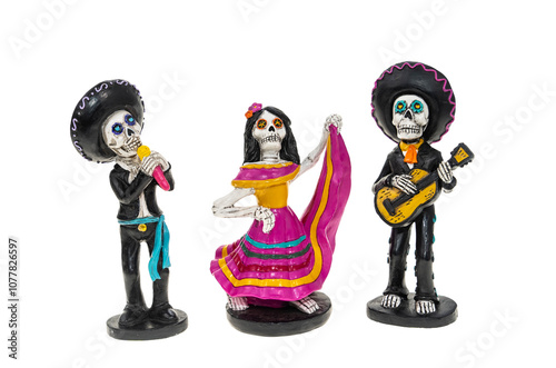 Skeleton character in costume for Day of the Dead dancing and playing the guitar isolated