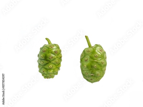 Fotografie A fruit of noni, Morinda citrifolia, Cheese fruit with a flower and a leaf, used as ingredients, vegetable, beverage and traditional