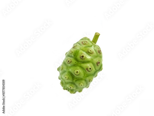 A fruit of noni, Morinda citrifolia, Cheese fruit with a flower and a leaf, used as ingredients, vegetable, beverage and traditional. photo