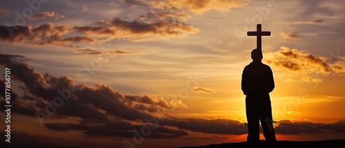 Sunset Silhouette of Person with Cross photo