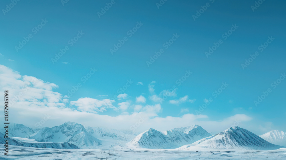 Obraz premium Blue sky fading into a distant horizon of snowy mountain peaks, the air crisp and clear