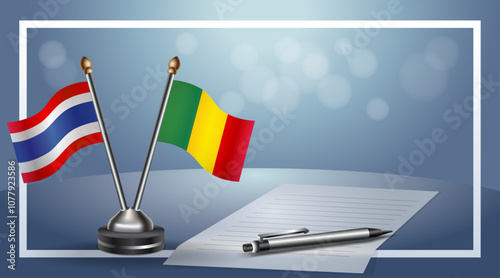 Thailand and Mali National flags on small table with bokeh background, cooperative relationship