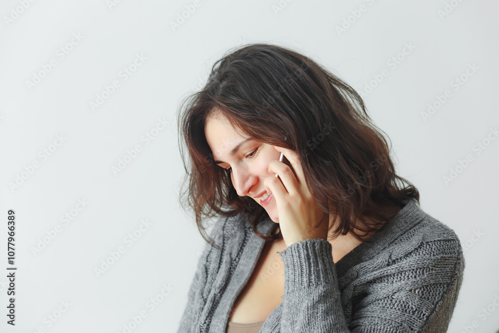 Attractive brunette woman using mobile phone Attractive brunette woman using mobile phone