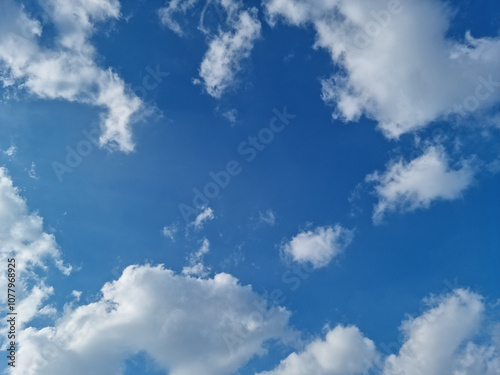  Blue sky and puffy clouds.