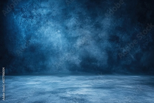 Blue textured concrete background with spotlight effect.