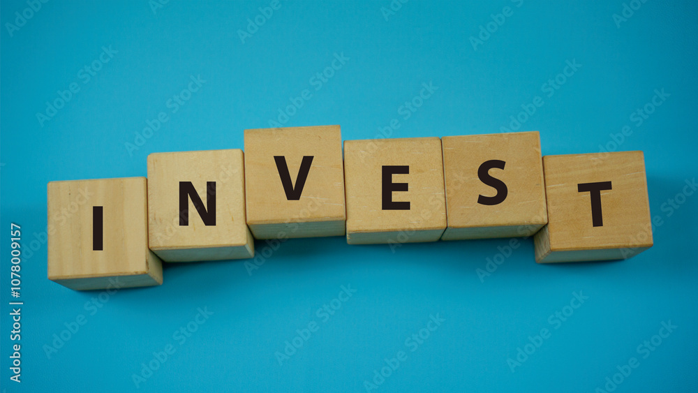 INVEST Concept Words on wooden blocks. Idea for healthcare, typography, medical, business and financial concept. Copy space for mockup, marketing and background INVEST Concept Words on wooden blocks. Idea for healthcare, typography, medical, business and financial concept. Copy space for mockup, marketing and background
