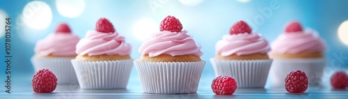 Delicious pink cupcakes with raspberry topping, a sweet treat for parties and celebrations photo