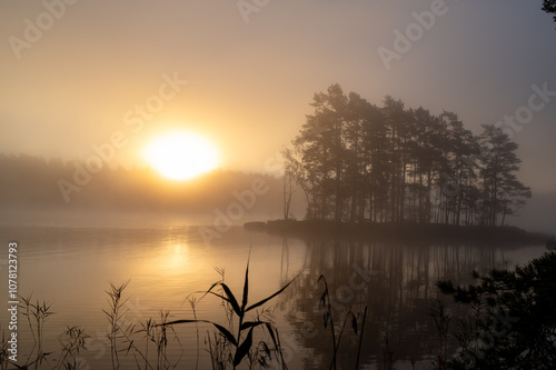 Sunrise a misty calm morning Motala Sweden