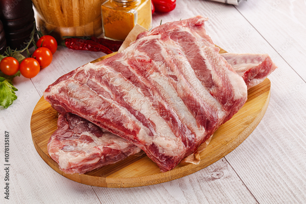 Raw pork ribs over board