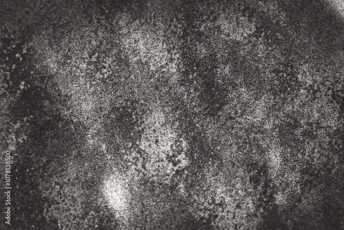 Dark gray to black background There is a pattern of spots and a rough, uneven surface. It feels raw and natural. Similar to the surface of rock or soil that has undergone erosion.