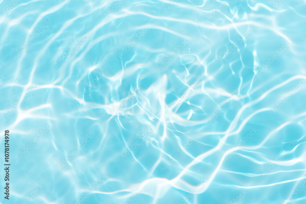Blue water with ripples on the surface. Defocus blurred transparent blue colored clear calm water surface texture with splashes and bubbles. Water waves with shining pattern texture background. Blue water with ripples on the surface. Defocus blurred transparent blue colored clear calm water surface texture with splashes and bubbles. Water waves with shining pattern texture background.