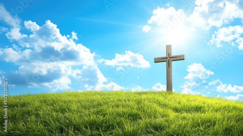 Simple cross on a grassy field under a bright blue sky, providing ample copy space for uplifting text