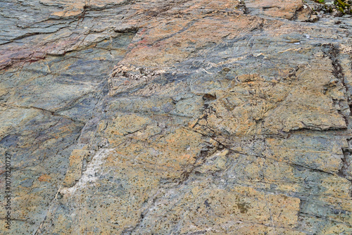 Weathered mountain rock texture - colorful stone background