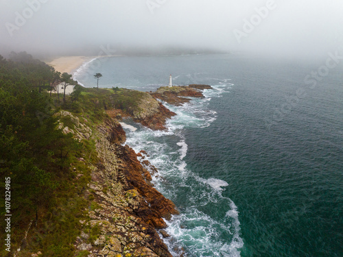 Faro y praia do Lago en Muxia Galicia photo