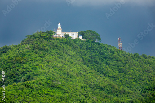 The lighthouse on Tao Phung Mountain in the tourist city of Vung Tau, Vietnam. The lighthouse was built by the French in 1862. photo